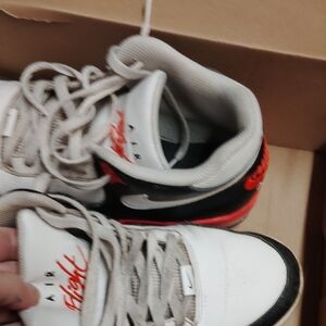 Nike Women's Black and White Sneakers with Red Highlights